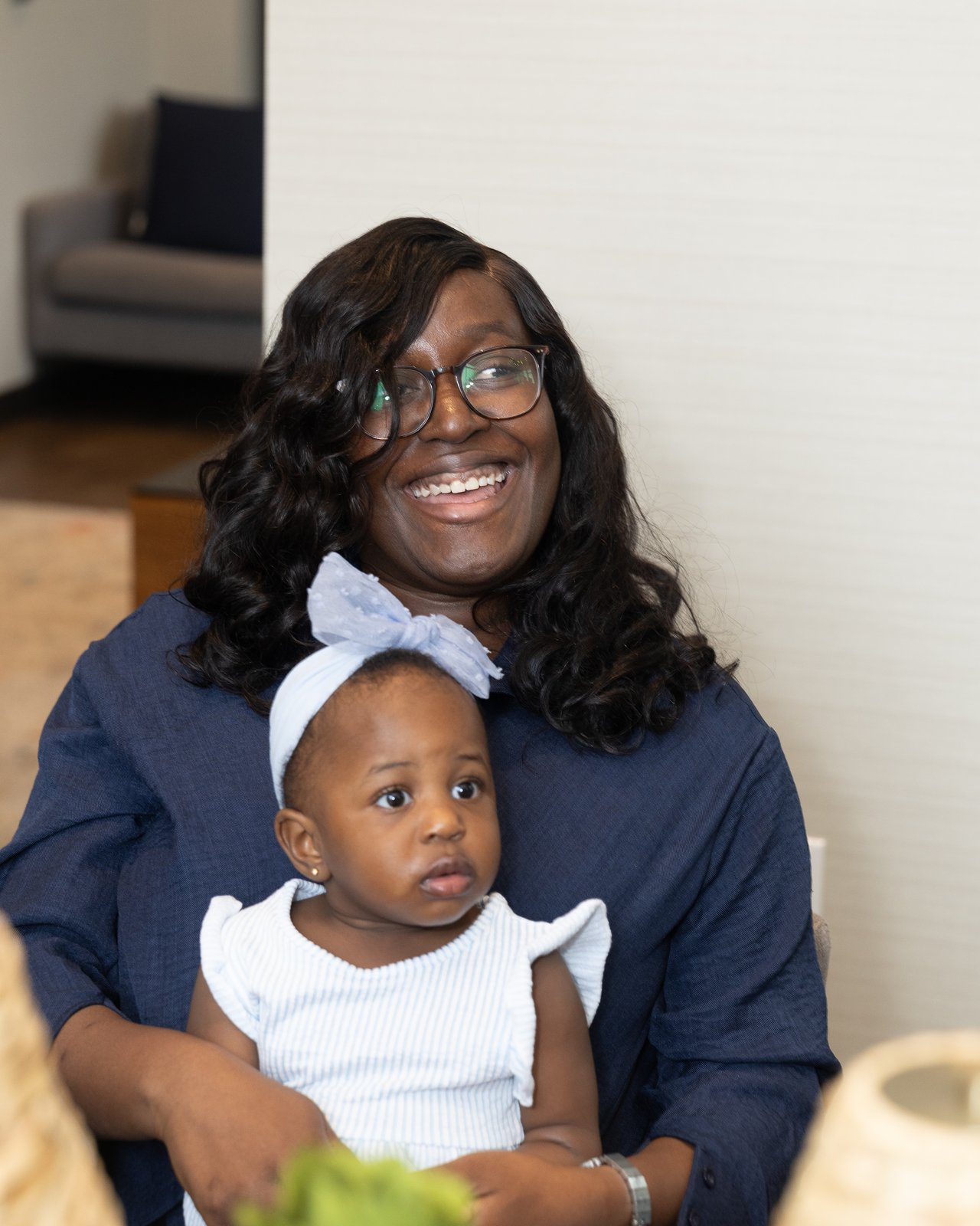 Candid moment between a guest and a little one at the celebration