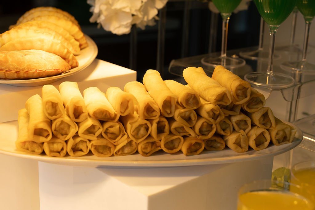 Platter of crispy spring roll appetizers on the food table