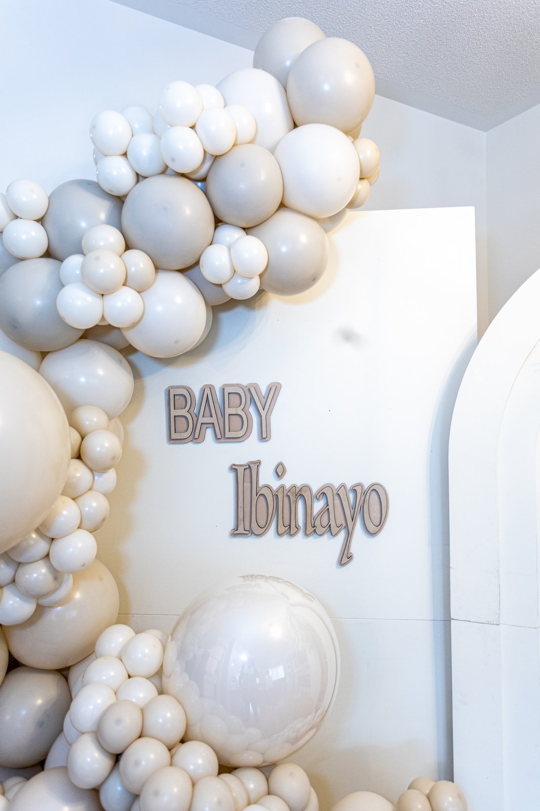 Close-up of the Baby Ibinayo wall lettering framed by balloons