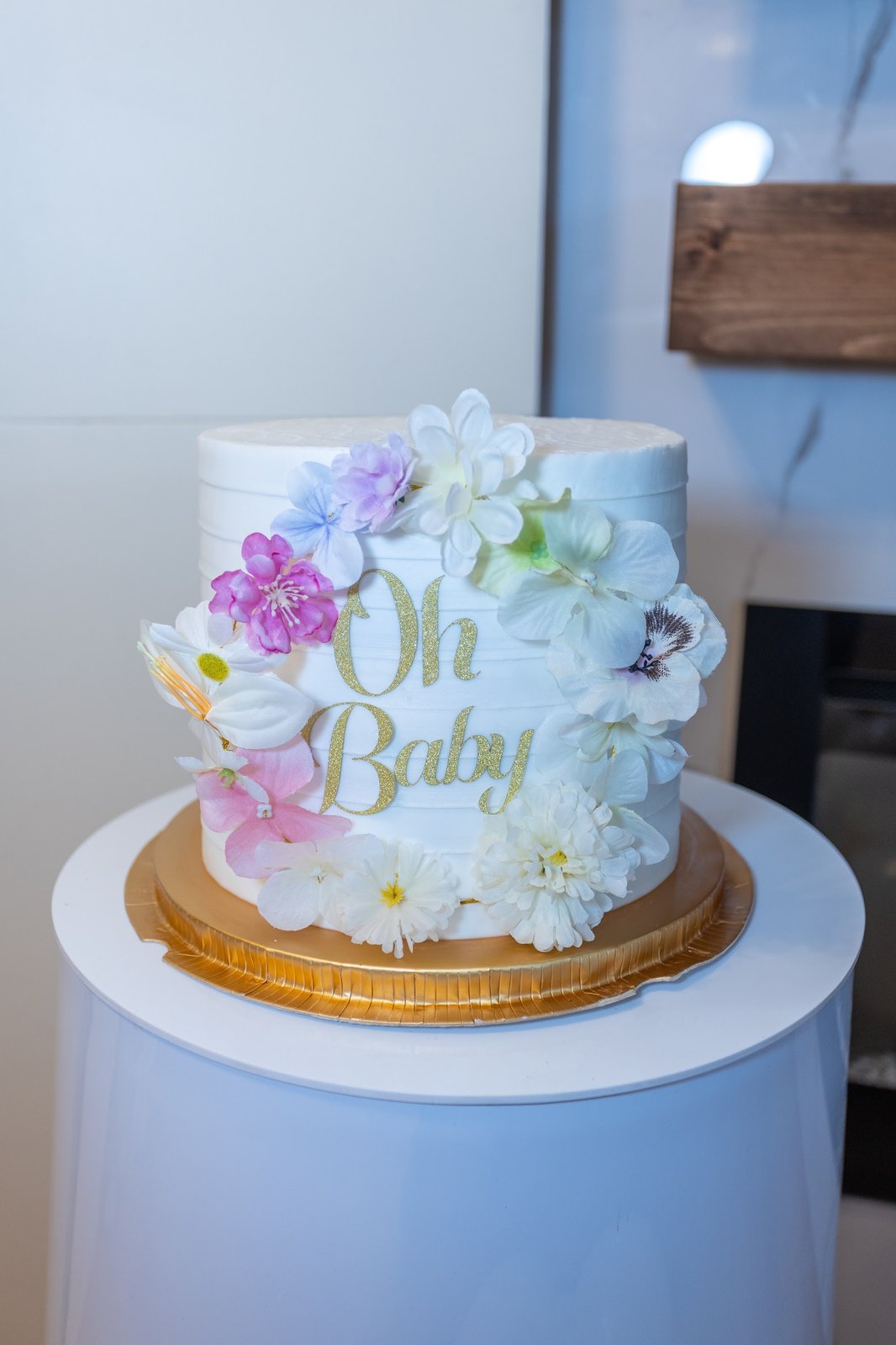 Oh Baby floral buttercream cake on a gold stand