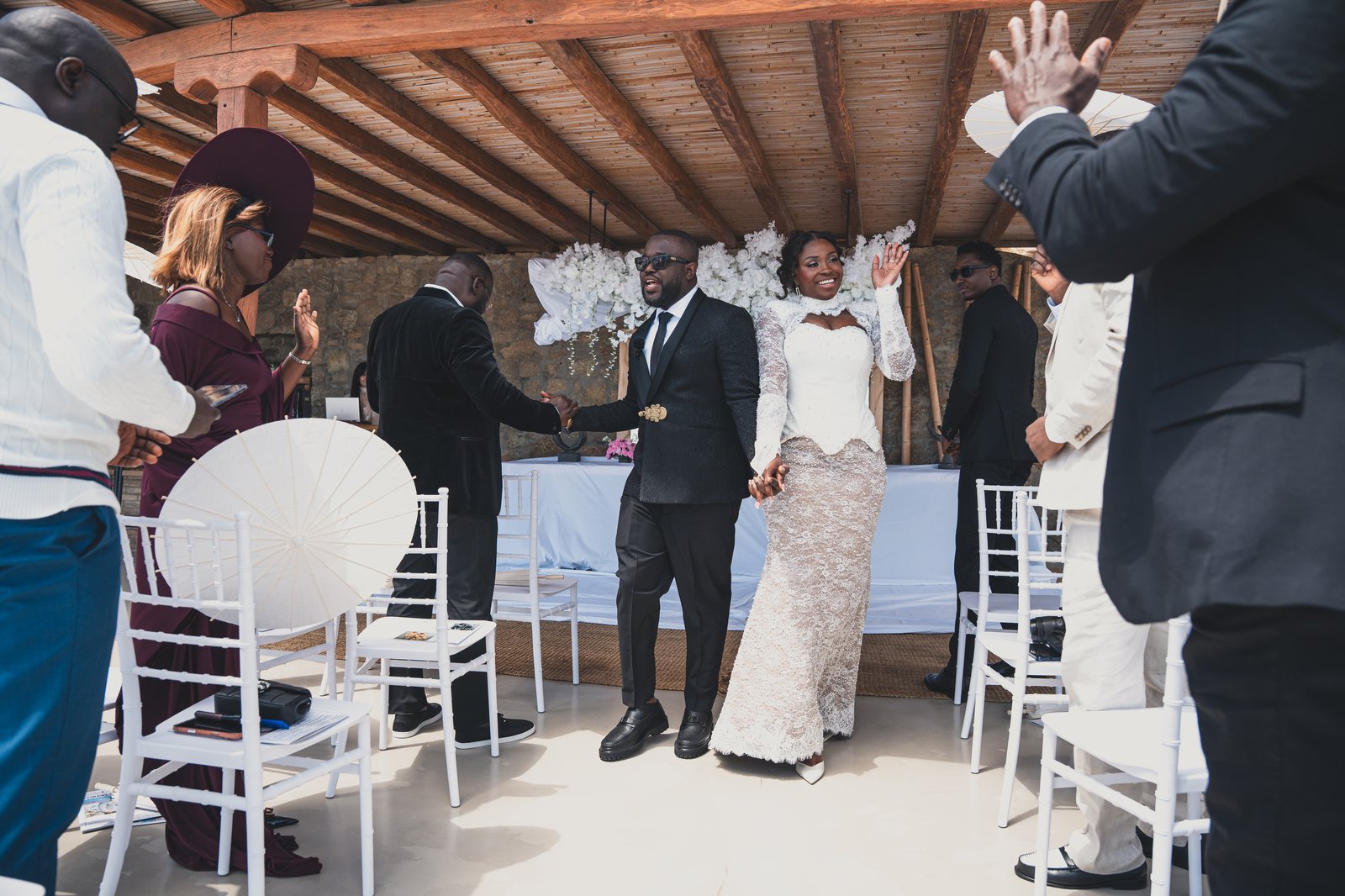 The couple sharing a moment together as guests look on during the ceremony