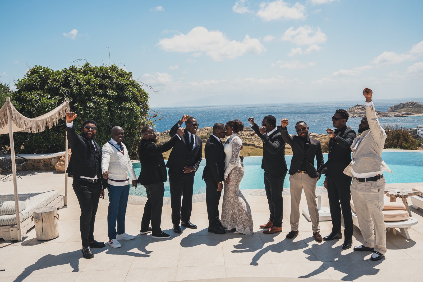 The wedding party celebrating together on the terrace