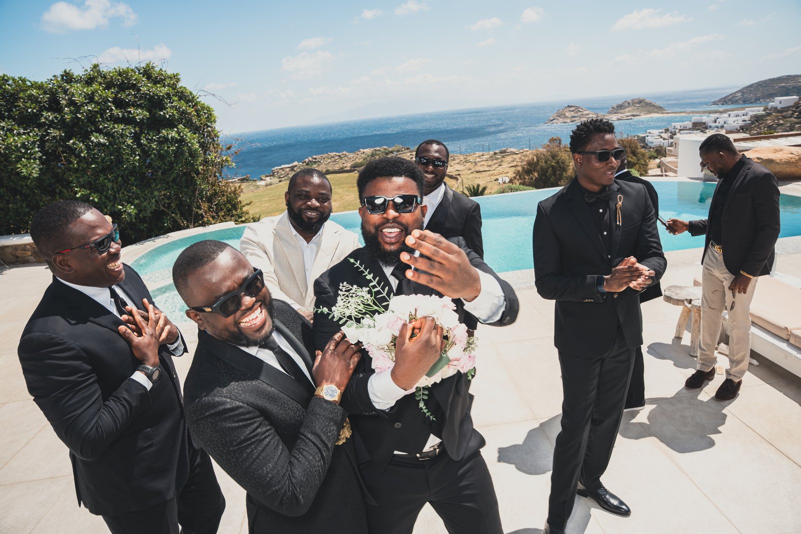 Groomsmen posing together in celebration