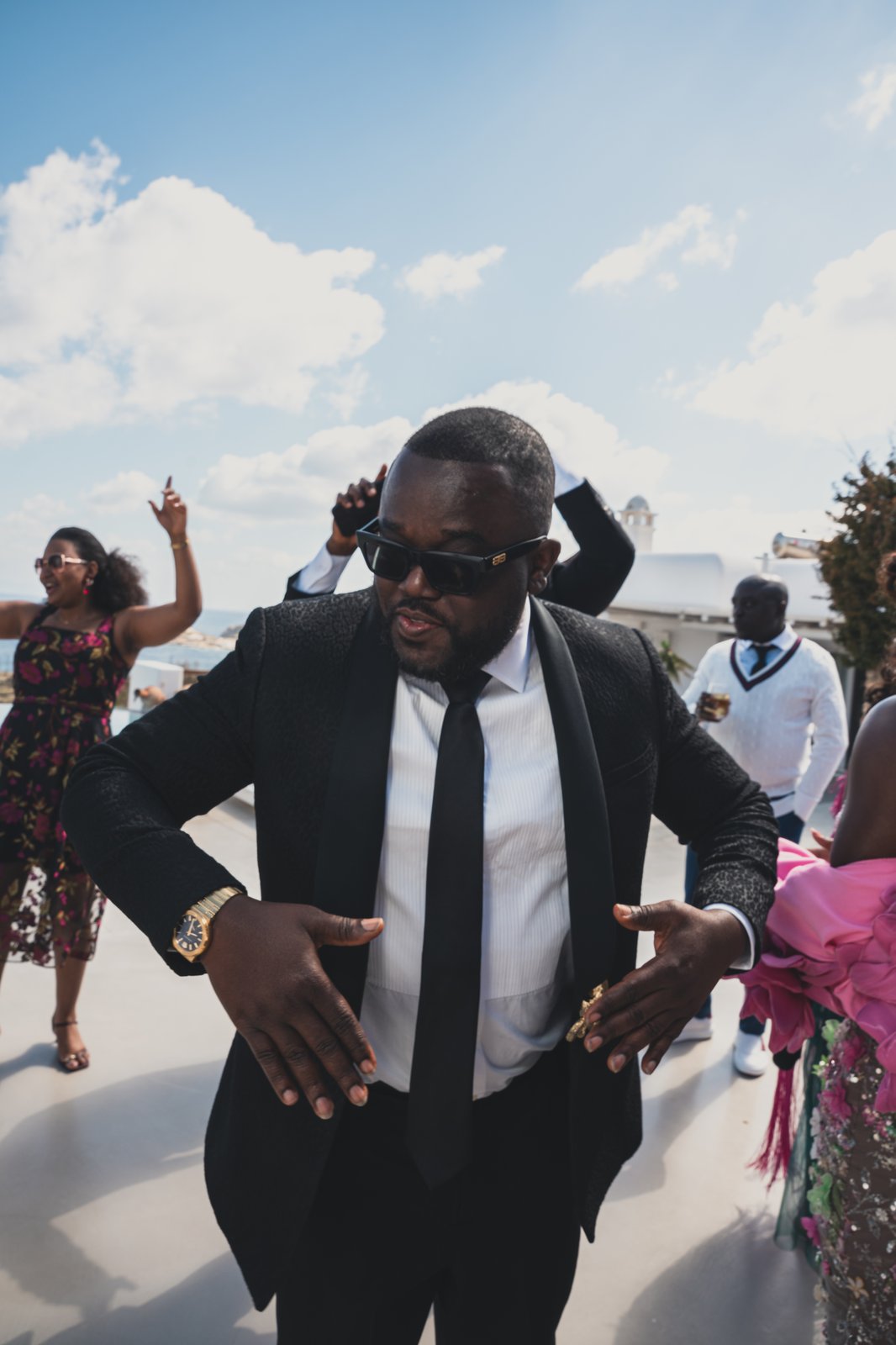 A groomsman dancing joyfully at the reception