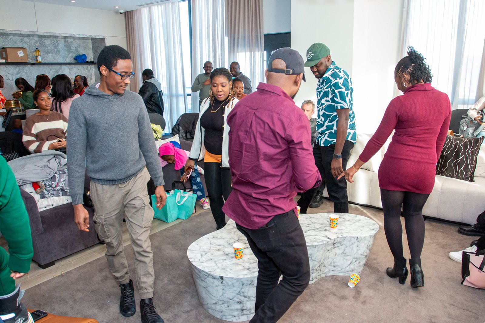 Guests mingling and dancing during the party